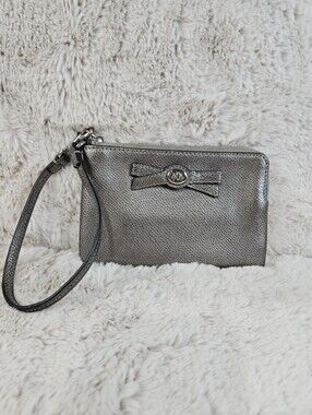 2015 Coach Metallic Silver Wristlet Clutch with Bow Accent